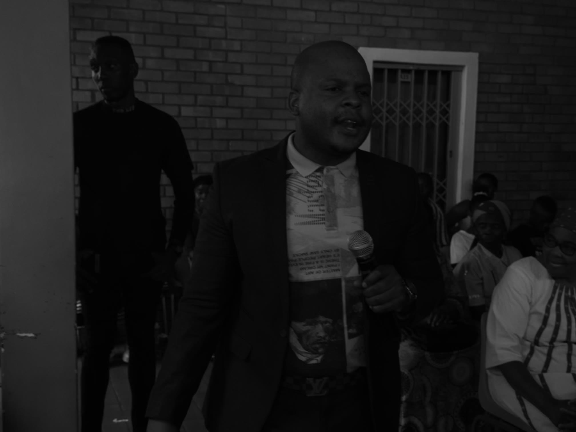 Prophet Matimba Nyandane speaking with the congregation visible behind him